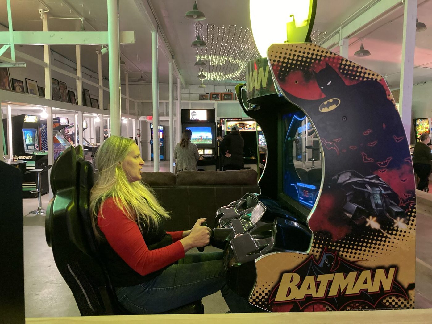 A guest at the wheel of a Batman sit-down driving game